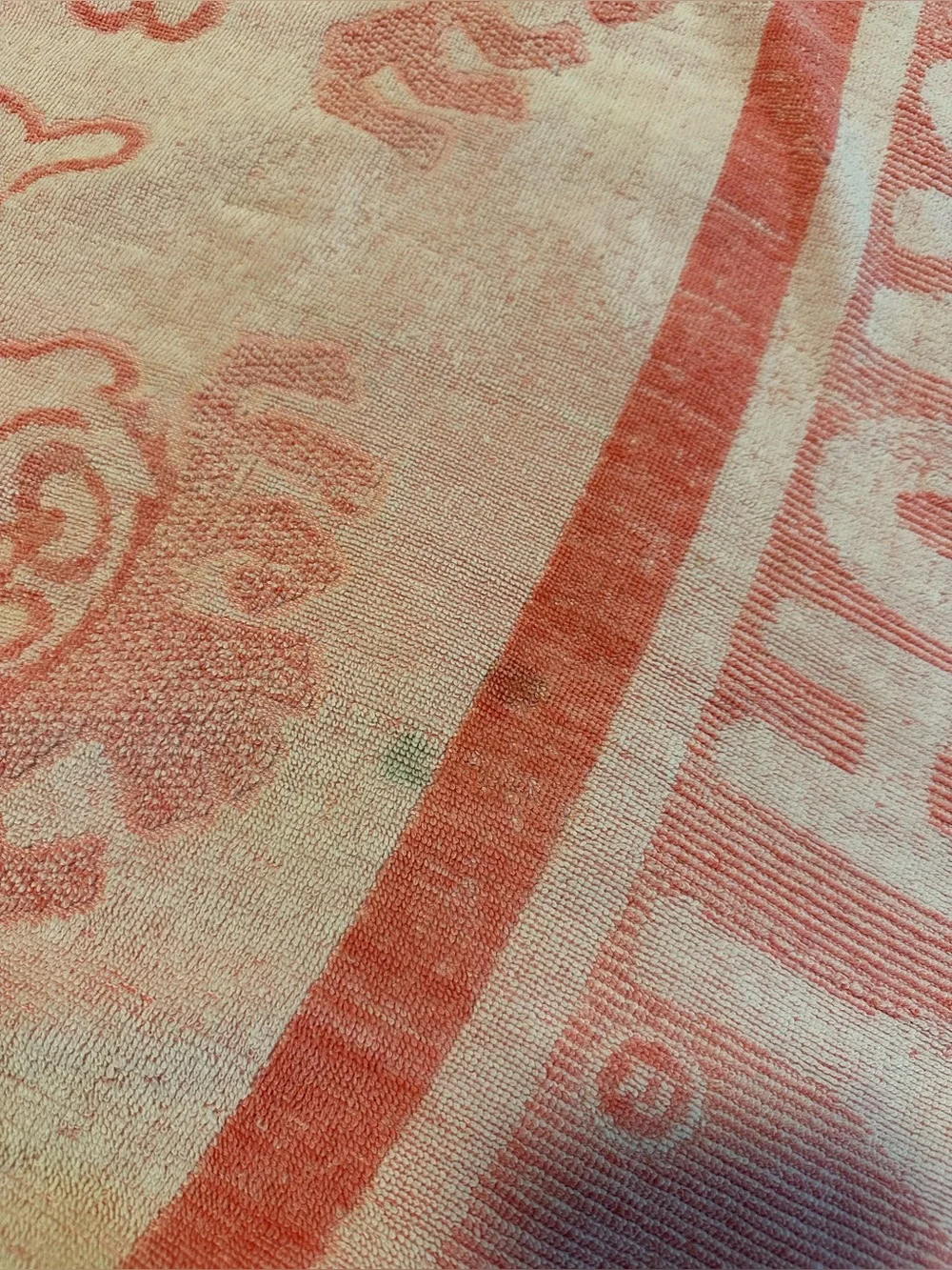 Pink and white 70s beach towel featuring Punchy, the Hawaiian Punch Mascot